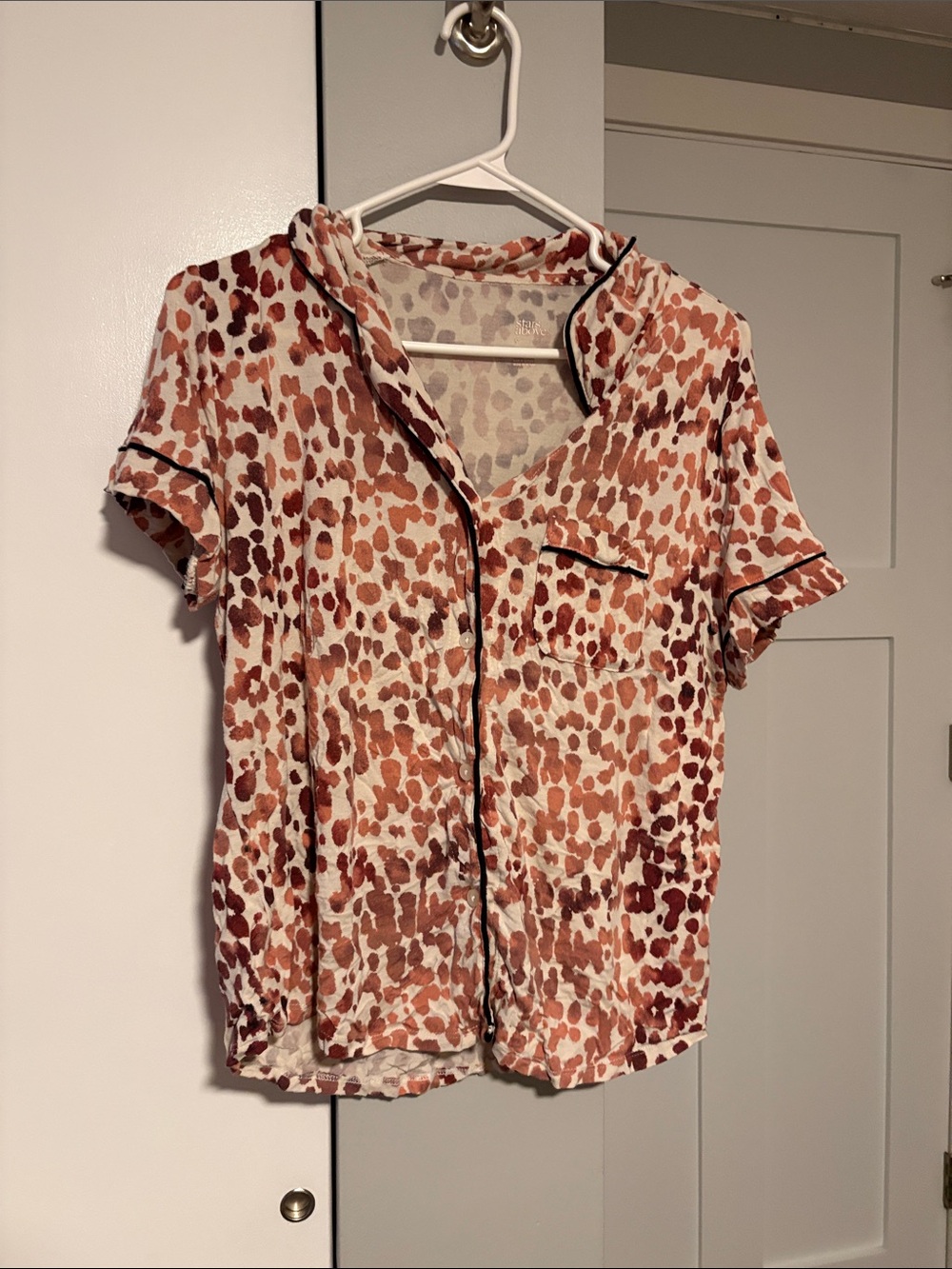 stars above Short-Sleeve Button-Down Top in Rust and Cream Animal Spot